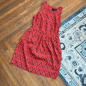 Red pink black and gold pattern dress